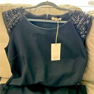 Marisa&Marie, cocktail, black stretchy dress with mesh shoulder design.